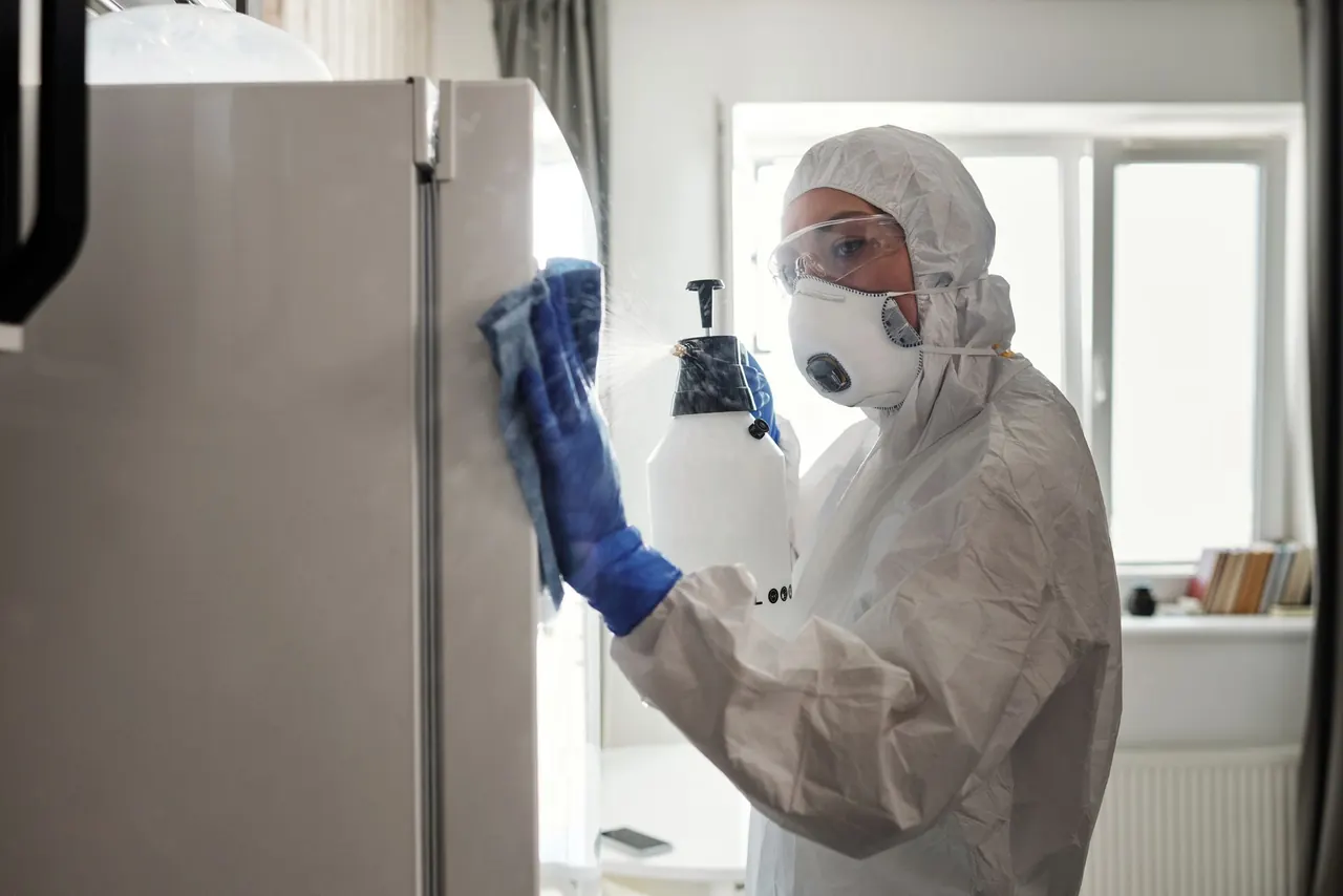 Technician carrying out diagnostic work on a refrigerator